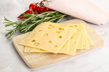 Sliced maasdam cheese with holes