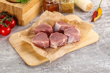 Uncooked raw pork tenderloin medallions