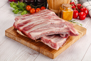 Raw pork ribs over board