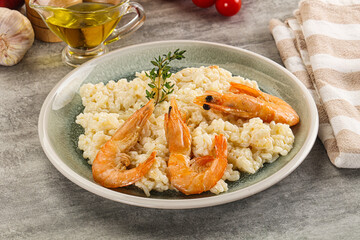 Italian risotto with prawn served thyme