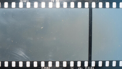 Dusty and grungy 35mm film texture material or surface. Dust particle and grain texture or dirt use for overlay film frame effect with space for vintage grunge design. Clipping patch