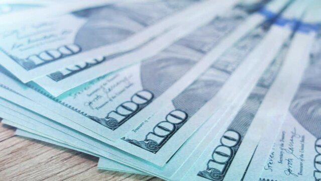 Pile of american dollars. 100 dollars bills close-up. Concept of finance and money payment. Currency exchange of banknotes. Buck cash. 