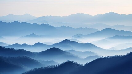 Obraz premium Misty mountain range at dawn, layered in hues of blue and gray for a peaceful setting