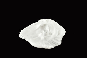 Shaving foam stain on a black background.