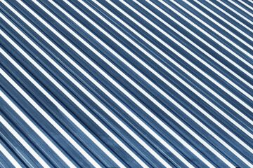 Corrugated aluminum roofing. Sunlight metal stripes. Striped pattern. Home roof. Geometric lines...