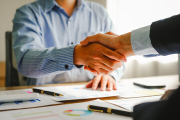 Businessman conducts financial discussions, sealing deals with handshakes. Expert in accounts,...