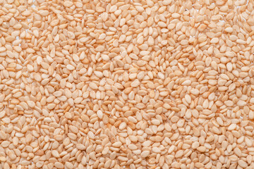 White sesame seeds closeup. Food background.