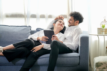 Cheerful loving couple enjoying morning coffee at home, happy spouses having conversation, standing in house