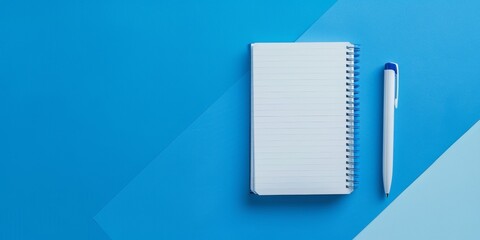 The background is completely mix Blue and white with no texture and notebook is in the right hand side