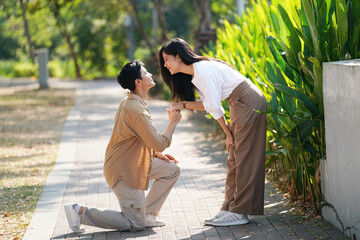 Beautiful young couple outdoors in the park. Portraits of lovers. Autumn. Spring. Holiday Valentine's Day.