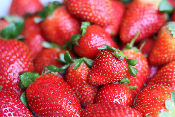 Red ripe strawberries background. Strawberry texture close up photo. Fresh organic berries macro. Eating fresh concept. 