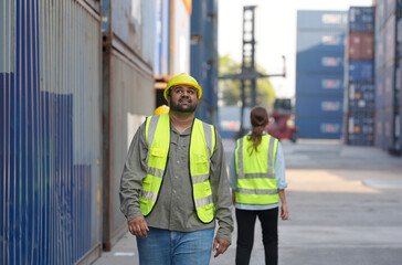 Foreman control loading containers box from cargo freight ship for import export, Foreman control industrial container cargo freight ship, Business logistic concept, Import and export concept