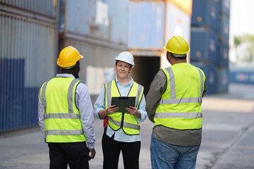 Foreman control loading containers box from cargo freight ship for import export, Foreman control industrial container cargo freight ship, Business logistic concept, Import and export concept