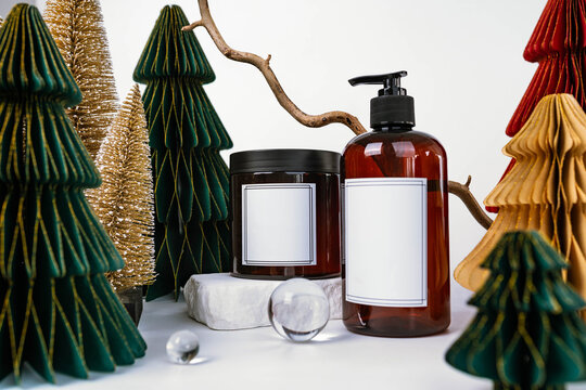 dark jar with lid and dispenser on the background of Christmas decorations, side view