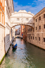 Iconic Bridge of Sighs and a gondolier in Venice in Veneto, Italy