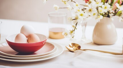 Obraz na płótnie Canvas Easter holiday. Ceramic plate with eggs beside flowers.
