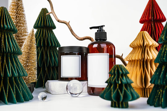 dark jar with lid and dispenser on the background of Christmas decorations, side view