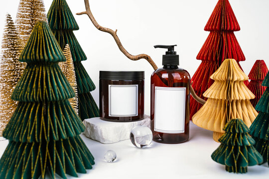 dark jar with lid and dispenser on the background of Christmas decorations, side view