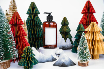 dark jar with dispenser on the background of Christmas decorations, side view