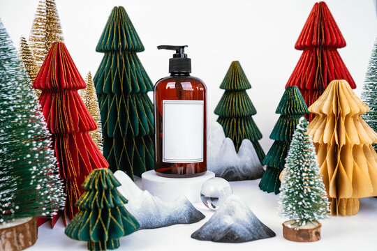 dark jar with dispenser on the background of Christmas decorations, side view