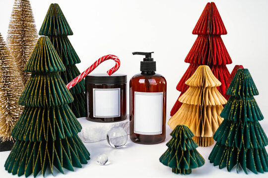 dark jar with lid and dispenser on the background of Christmas decorations, side view