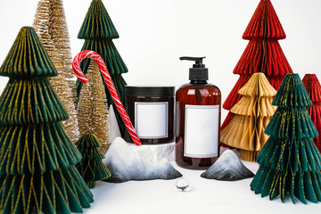 dark jar with lid and dispenser on the background of Christmas decorations, side view