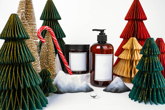 dark jar with lid and dispenser on the background of Christmas decorations, side view