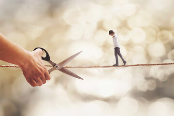 surreal person walks on a wire threatened by a hand with scissors that wants to cut it, abstract...