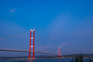 Fototapeta premium 1915 Canakkale Bridge at sunset. Development or economy of Turkey concept photo