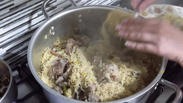 A footage of mutton and mutton biryani cooked in hot rice