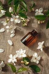 jasmine essential oil on burlap background