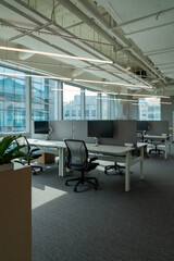 Interior of modern empty office building.Open ceiling design.Equipped with automatic lifting table and LCD screen.