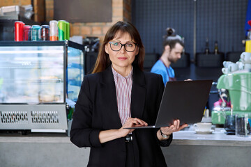 Portrait of business woman, accountant, lawyer, coffee shop cafeteria restaurant owner