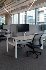Interior of modern empty office building.Open ceiling design.Equipped with automatic lifting table and LCD screen.