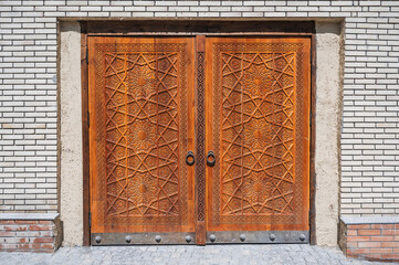 modern carved wooden gate with Islamic Uzbek carved pattern with stars ornament in oriental style...