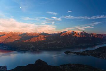 The lights and colors of the sunset on Lake Como, near the town of Tremezzo, Italy - December 24,...