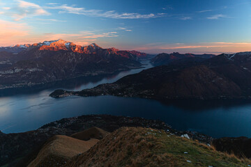 The lights and colors of the sunset on Lake Como, near the town of Tremezzo, Italy - December 24,...