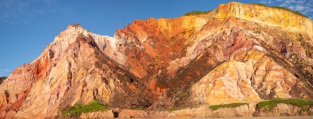 Panorama of very colorful seaside cliffs