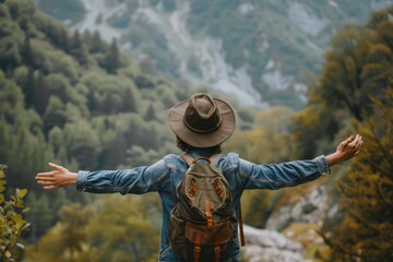 A Solo traveler backpacker opening his arms arriving at the forest,, embracing the nature, enjoying the travel, travelers life