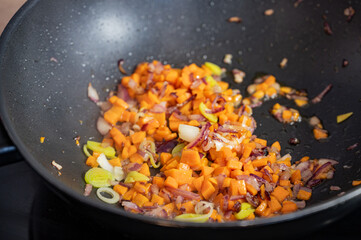 wok pan with finely chopped vegetables