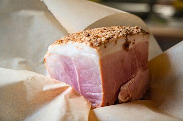 boiled smoked ham in spices and paper, home cooking