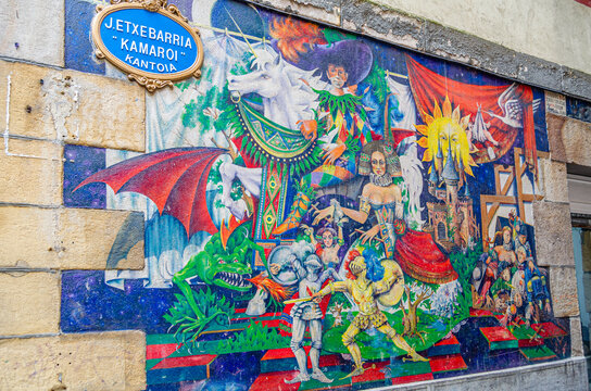 BILBAO, SPAIN - MAY 9, 2014: Urban art in a narrow street in the old town of Bilbao, Basque Country Spain, called "Mural del Canton J. Etxebarria &laquo;Kamaroi&raquo;", made by Juan Zarate Ibargoitia in 1994