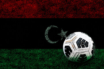 Football ball and field with Libya flag, tournament or competition, soccer ball and national flag - obrazy, fototapety, plakaty