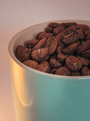 Coffee beans in a coffee mug