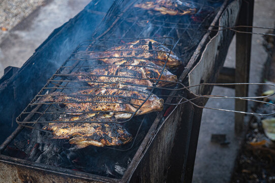 grilled fish, sea fish grilled over a charcoal fire on the beach, Indonesian seafood barbeque.