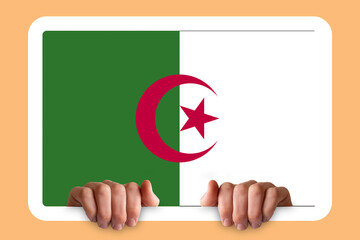Hands holding a white frame with Algeria flag, independence day idea, celebration or campaigning 