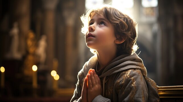 Young boy praying in church