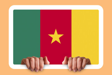 Hands holding a white frame with Cameroon flag, protest or social issues in Cameroon, two hands 