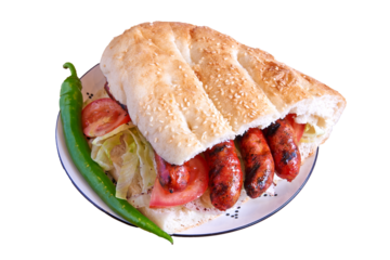 Merguez kebab sandwich on decorated plate on wooden textured table