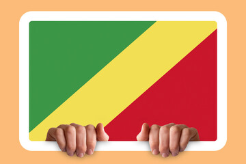 Hands holding a white frame with Republic Of The Congo flag, celebration or campaigning concept